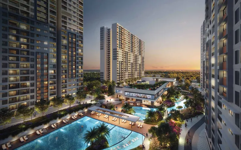The clubhouse and pool deck at dusk, Adarsh Welkin Park Apartments